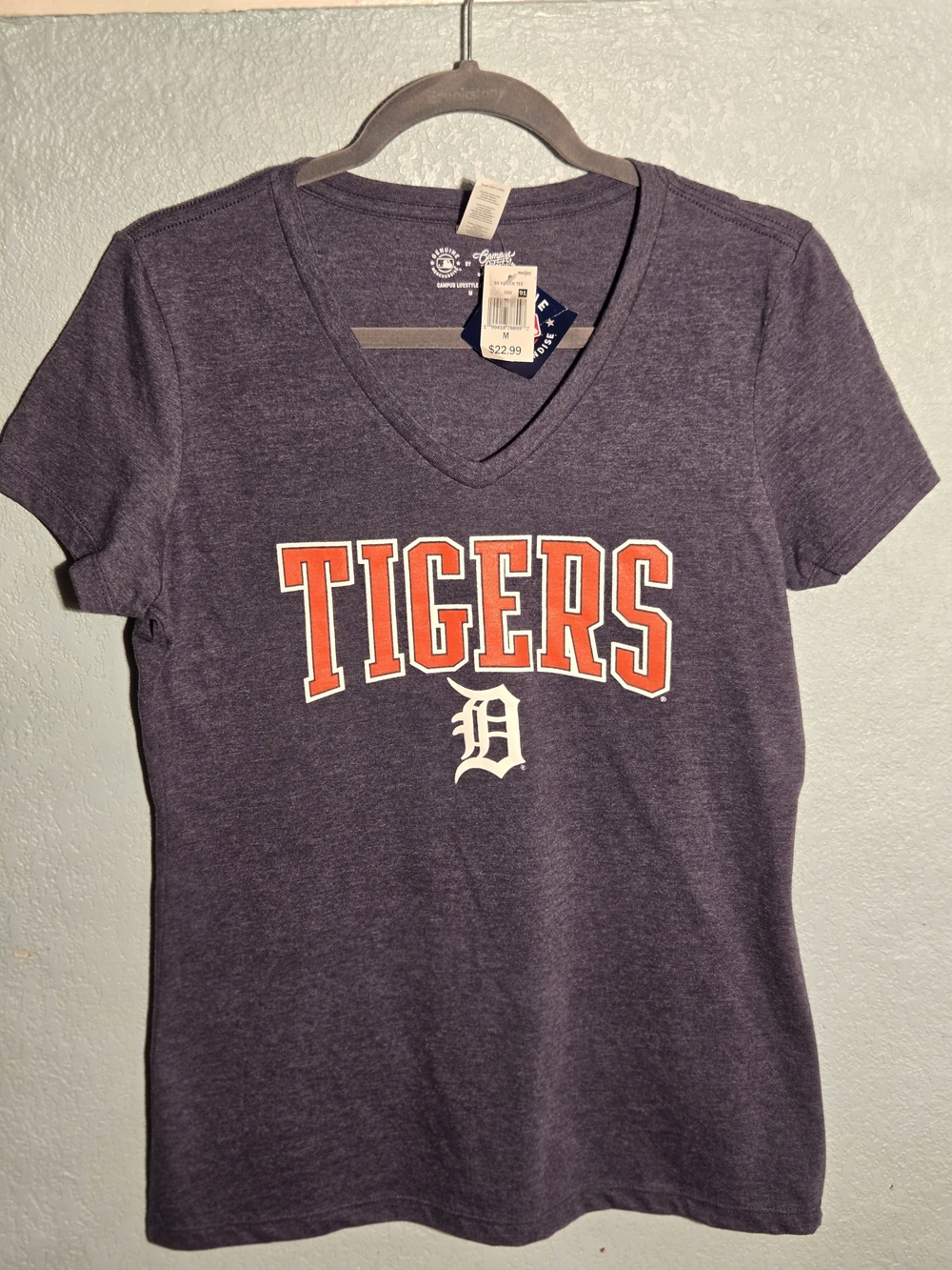 Genuine Merchandise Navy Tee with Red & White Logo Tag
